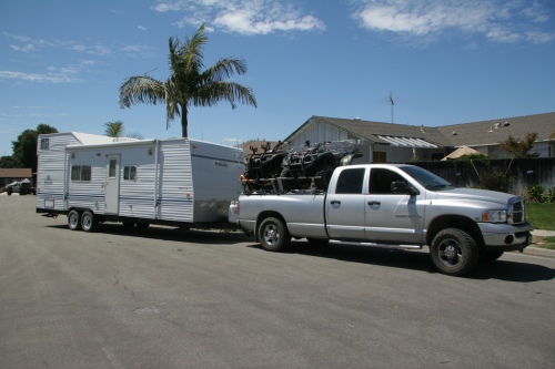Truck with ATVs towing a trailer